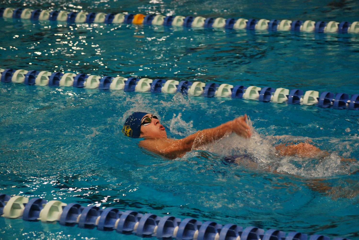 Sophomore Ryan Miller swims the backstroke as part of his race in the 200 IM.